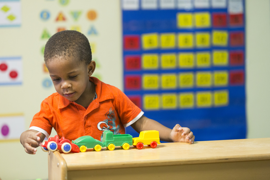 Child playing with trains
