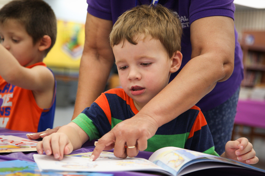20140923_BookFair_0259 Teacher helping young boy read