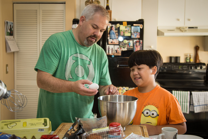 Father and son baking together