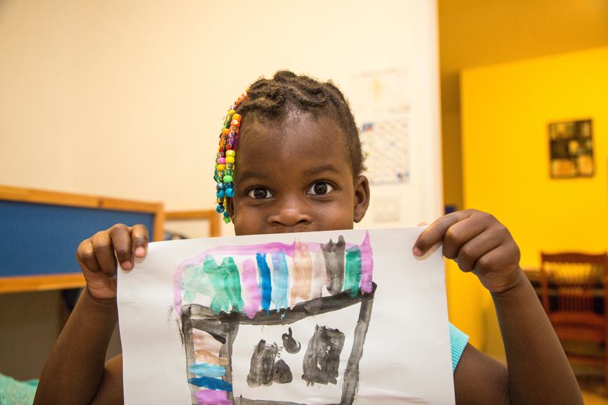 20160912_CSC_DebbieManigat_0020 Young girl holding up her drawing
