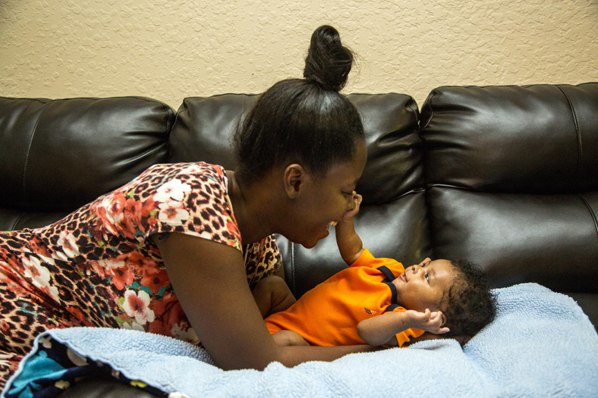 Mother playing with infant