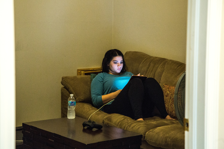 Teenager playing on the computer