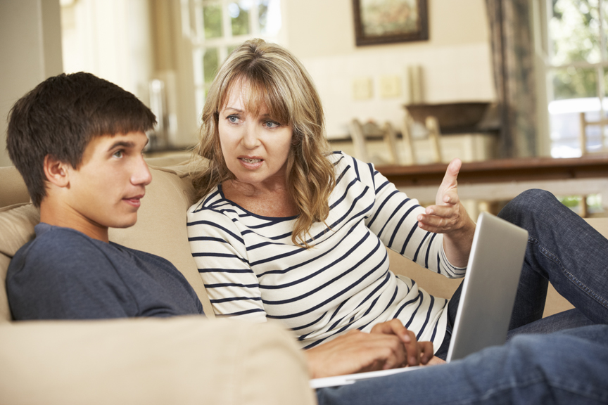 Mother having serious conversation with teenage son