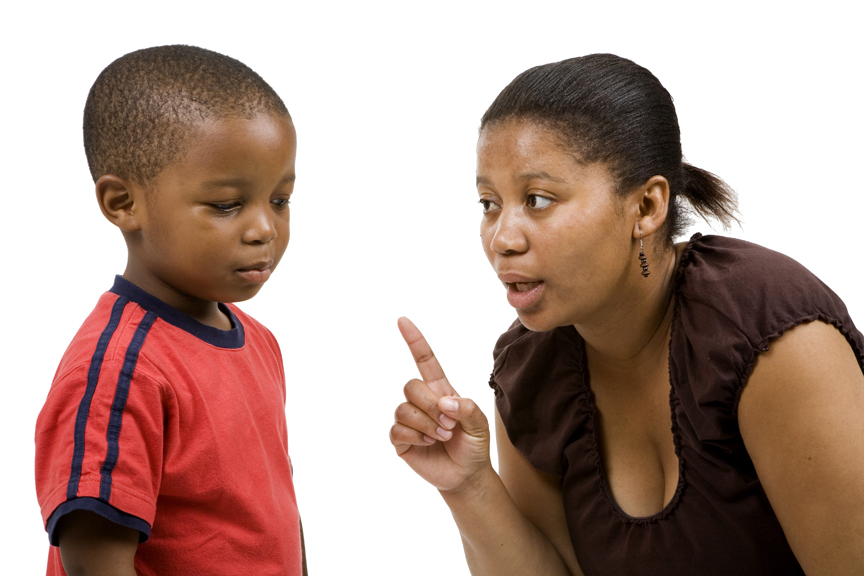 Mother point finger at young son