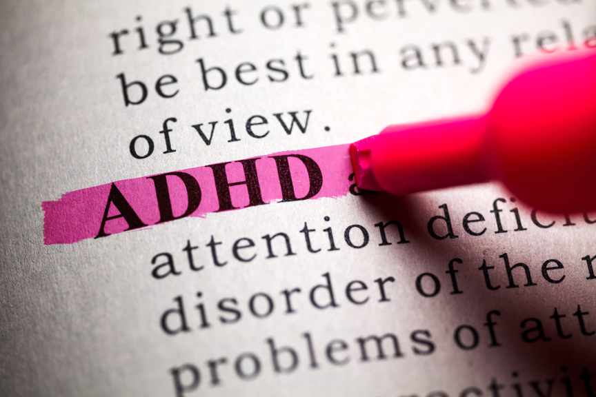 ADHD definition highlighted in dictionary in pink
