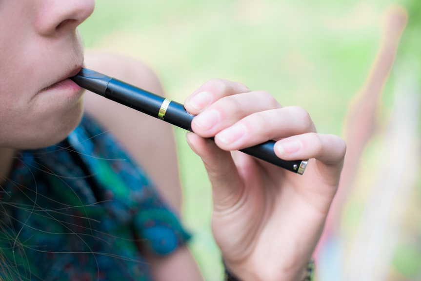 Teen boy vaping