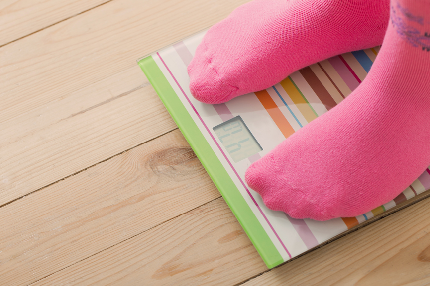 iStock-590600896 Person on a scale