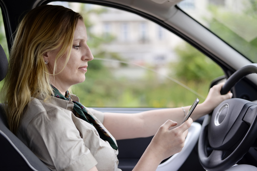 Woman texting and driving