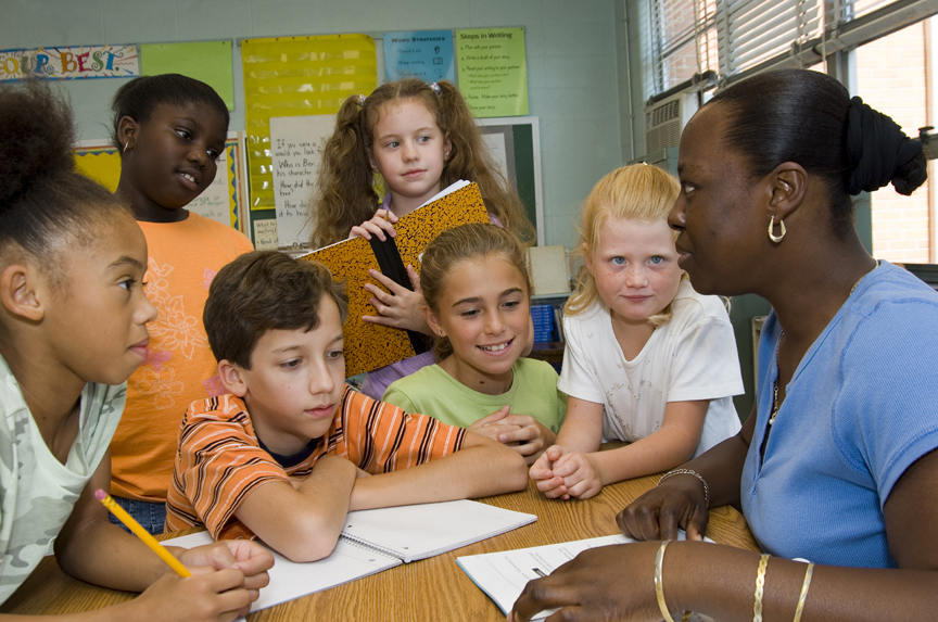 iStock_000000830600Large Teacher and students in a classroom