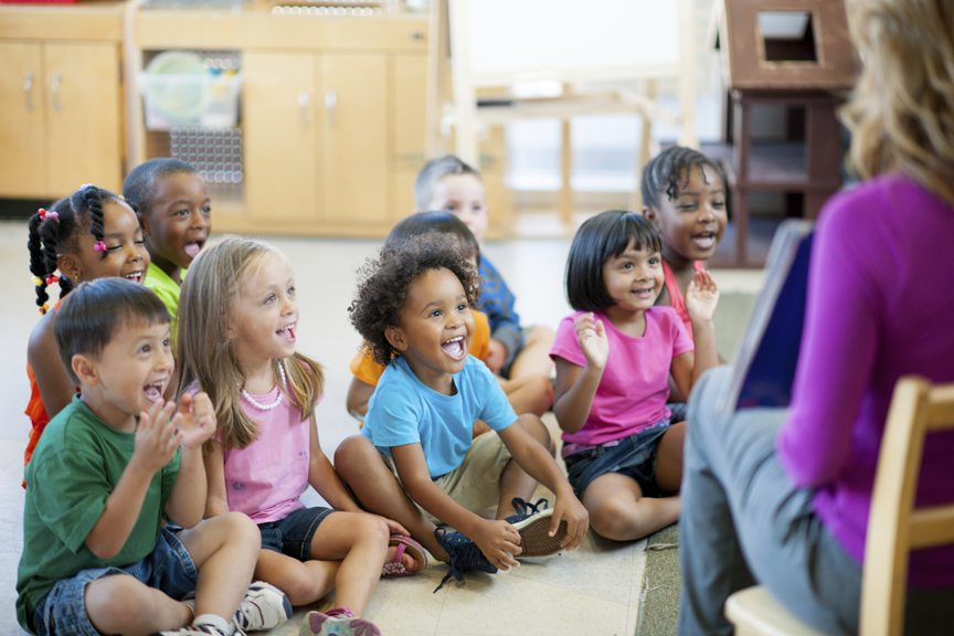 Teacher reading to classroom