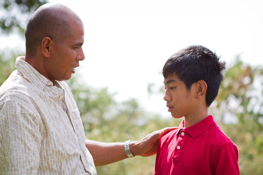 Man and boy talking