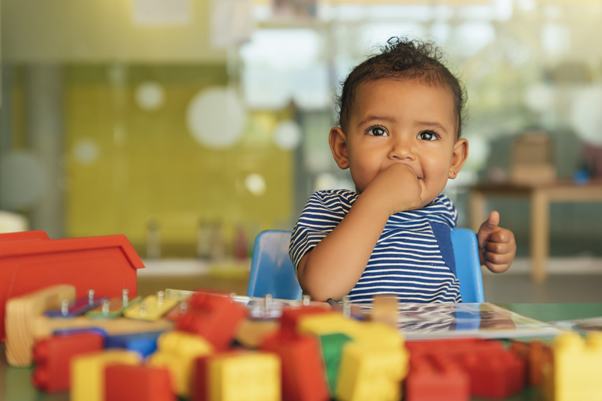 small child playing with toys