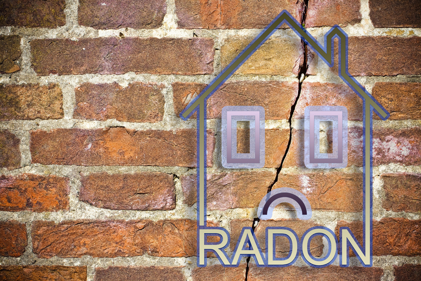 Brick wall with home graphics and the word Radon