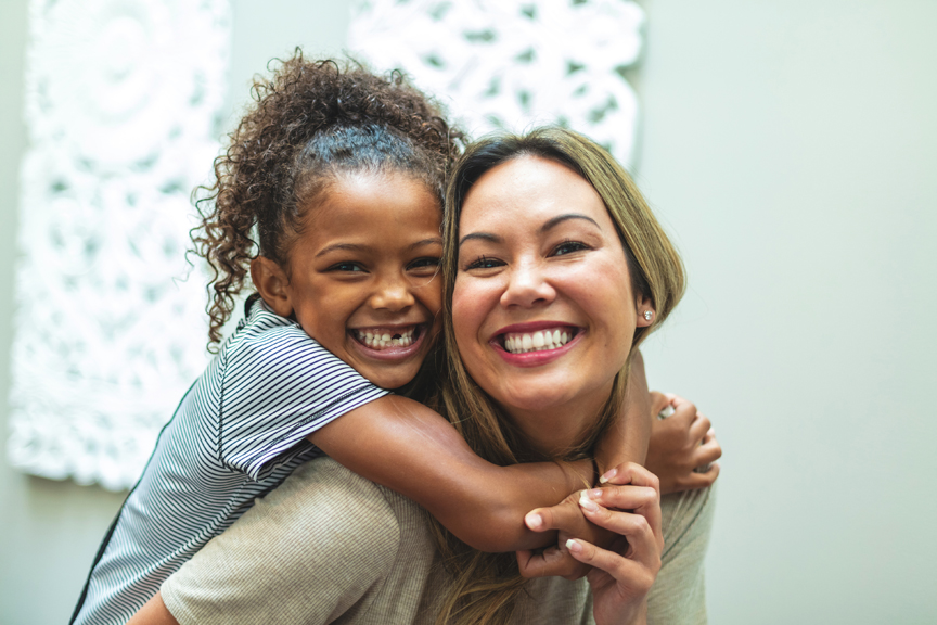 Girl hugging woman.