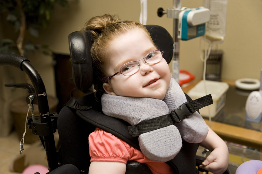 Girl in wheelchair.