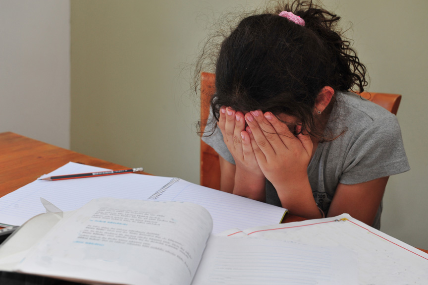 Girl frustrated with homework.