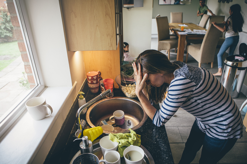 Mother frustrated in kitchen setting