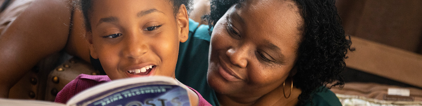 Mother and daughter reading together.